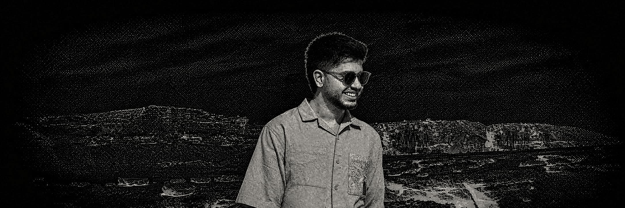 Halftone portrait of Erfan Pouya in a rocky desert landscape.